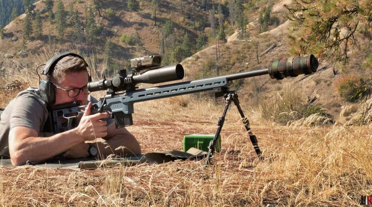 Gavin of Ultimate Reloader shooting the Bergara Competition Elite in an MDT ACC Elite chassis prone off a CKYE-POD bipod on a dry grassy hillside