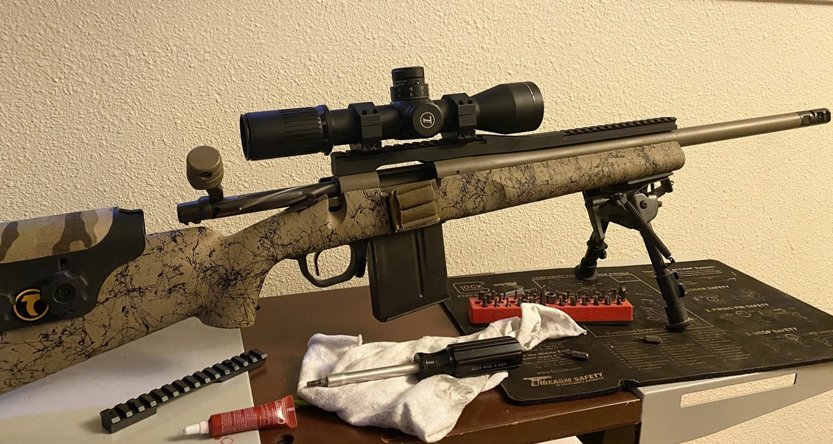 Customer photo. This rifle will be used for hunting predators at night with a clip on night vision device.